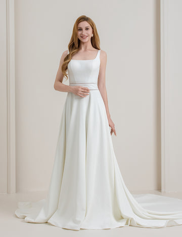 New-style strapless wedding dress with off-the-shoulder design, sculpted waistline and a satin train featuring a bow at the back that subtly reveals the waistline